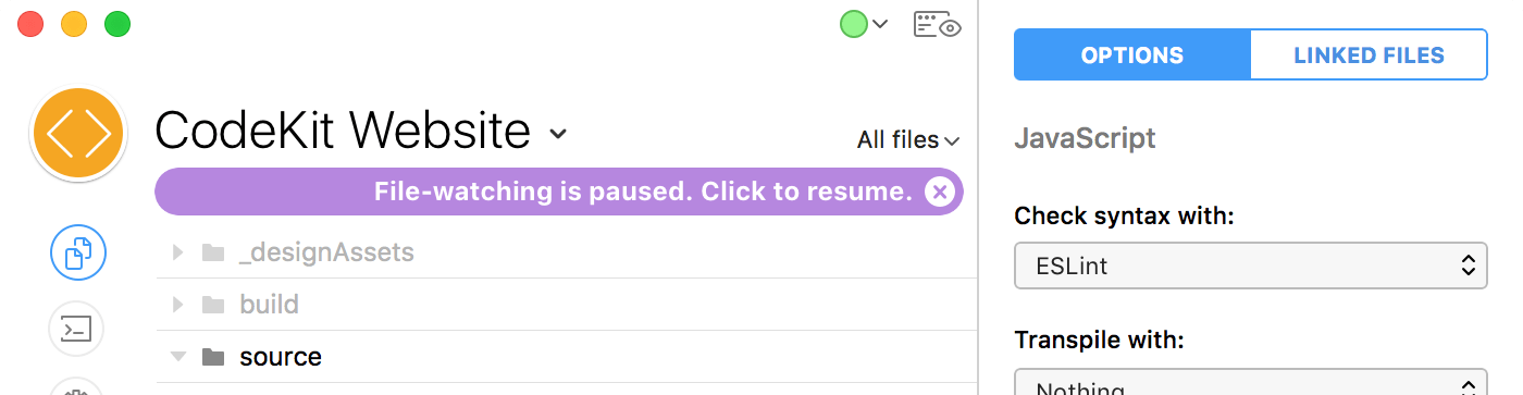 The file-watching-is-paused bar in the CodeKit window